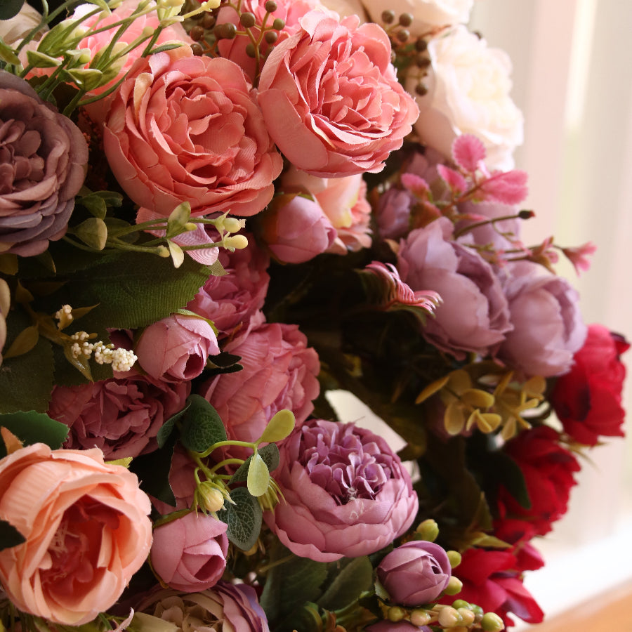 Artificial pink and violet peonies