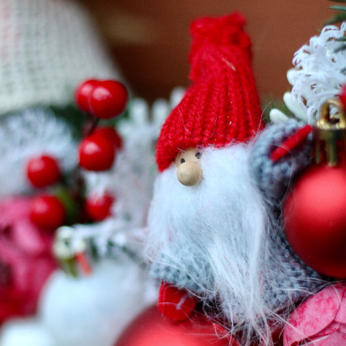 A handcrafted Santa, a detail of a handmade Christmas wreath