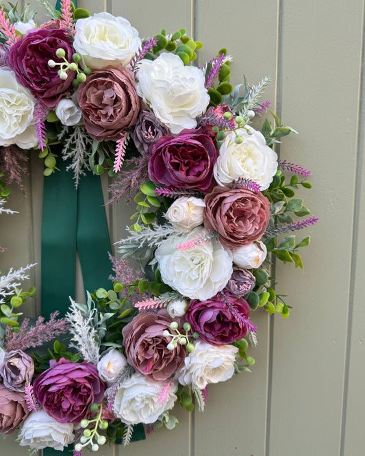 Half of floral wreath with faux mauve and ivory peonies