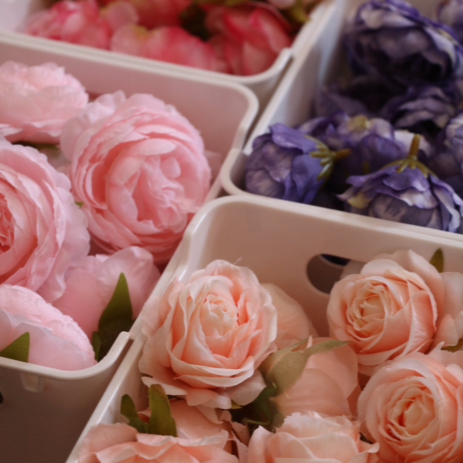 Faux peonies and roses in boxes